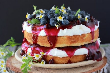 Blueberry Torte Recipe pretty simple to make . . . white cake with blueberry pie filling and cream cheese icing= a blueberry stack cake! by cookingwithruthie.com