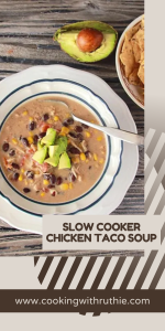 This slow cooker chicken taco soup combines the bold flavors of taco seasoning with tender chicken and creamy cream cheese. It's a satisfying and easy-to-make meal that the whole family will love. Serve with avocado slices and crunchy tortilla chips for the ultimate comfort food experience. #ChickenSoup #SlowCookerMeals #TacoSoup #FamilyDinner #CookingWithRuthie
