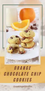 Chewy chocolate chip cookies with a bright citrus twist — these Orange-Drop Chocolate Chip Cookies bring sunny orange flavor to cozy December evenings or holiday cookie trays. 🍪 | cookingwithruthie.com #orangechocolatecookies #holidaybaking #winterdesserts #cozycookies #christmascookies #cookiesofinstagram #pinterestfood #cookingwithruthie