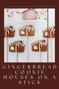 Adorable gingerbread cookie houses baked right onto sticks &mdash; fun to decorate, festive, and perfect for December parties, gift trays or holiday dessert tables. A sweet seasonal treat that brings holiday charm to every gathering! 🍭 | cookingwithruthie.com #gingerbreadhouses #holidaycookies #christmasbaking #festivetreats #winterdesserts #cookieideas #holidayparty #cookingwithruthie