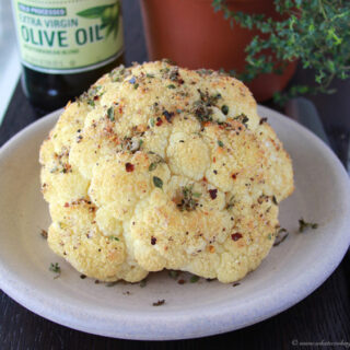Spiced Roasted Whole Cauliflower is filled amazing flavors that will leave you speechless! www.cookingwithruthie.com