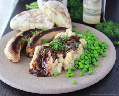 Bangers and Mash with Brown Gravy is a traditional Irish dish that'll whisk you away to Ireland with every bite! www.cookingwithruthie.com