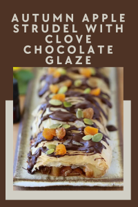 Flaky strudel pastry filled with spiced apples and drizzled with rich clove-infused chocolate glaze. The perfect fall dessert! || cookingwithruthie.com #AppleStrudel #FallDesserts #ChocolateGlaze #AutumnBaking #CookingWithRuthie