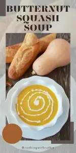 This rich butternut squash soup gets a twist with a creamy cinnamon crema topping. Perfect for cozy nights and autumn dinners! || cookingwithruthie.com #SquashSoup #AutumnFlavors #CreamySoup #SeasonalRecipes #CookingWithRuthie
