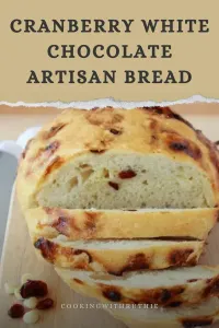 Soft, slightly sweet bread studded with tart cranberries and creamy white chocolate &mdash; this artisan loaf is perfect for cozy winter breakfasts, holiday brunches or festive dinners. Warm, comforting and holiday-ready! 🍞✨ | cookingwithruthie.com #holidaybread #cranberrybread #whitechocolate #festivebaking #winterbrunch #artisanbread #pinterestfood #cookingwithruthie